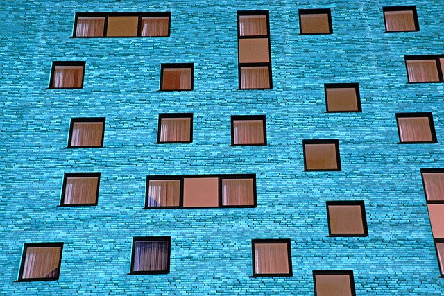 Commercial office building with glass facade representing the type of property Kamfms manages